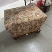 A fabric covered storage stool.