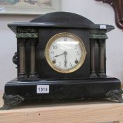 A wooden Palladian style mantel clock.