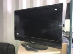 A Toshiba 31" flat screen TV (no remote)