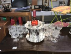 A silver plated bottle stand and 3 sets of wine glasses