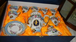 A boxed hand painted Dutch fine porcelain tea set, (box distressed).