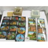 2 sets of coloured magic lantern slides entitled 'Robinson Crusoe' and 'Swiss Family Robinson'.