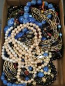 A mixed lot of necklaces and beads