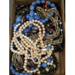 A mixed lot of necklaces and beads