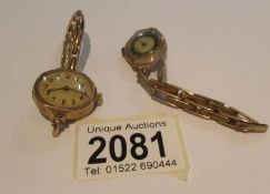 2 old gold wrist watches on yellow metal bracelets.