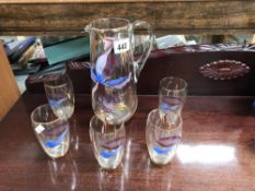 A floral overlaid glass drinks set