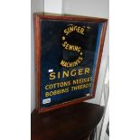 A Singer cotton reel cabinet.