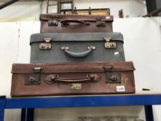 3 vintage suitcases