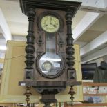 A mahogany wall clock.