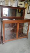 A good Victorian astragal glazed cabinet with mirror back.