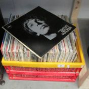 A box of assorted LP records.