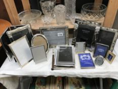 A quantity of silver plated photo frames