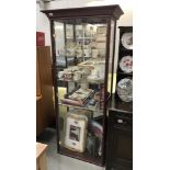 A darkwood stained display cabinet