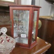 A jewellery display cabinet 'Asprey, London'.