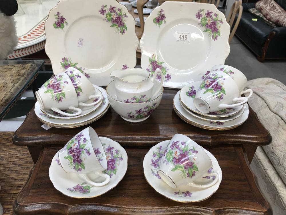 A 6 piece teaset including 6 cups, 5 saucers, 6 side plates, 2 plates,