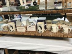 A quantity of commemorative mugs