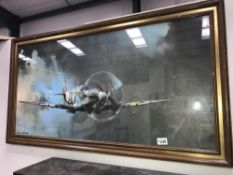 A large framed print of a Spitfire signed Barrie. A. F.