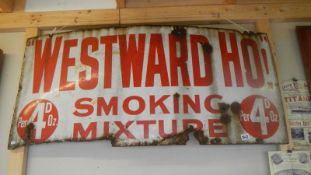 A Westward Ho! Smoking Mixture enamel sign, approximately 50 x 22.25 inches.