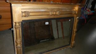 A Victorian gilded overmantel mirror, in need of attention.