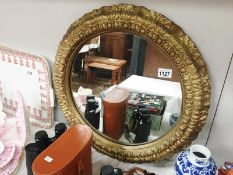 A gilt framed ormulu style mirror