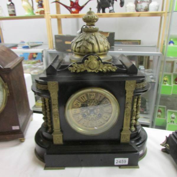 A 19th century brass and slate mantel clock, named on face Long & co.