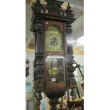 A mahogany wall clock.