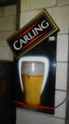 A vintage Carling advertising sign.
