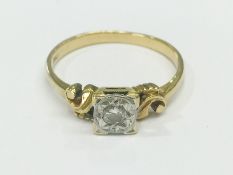 An 18ct gold ring set diamond, size R.