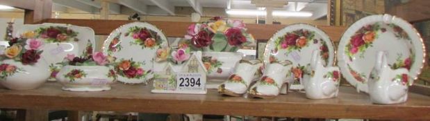 12 items of Old Country Roses china including floral bouquets, swan and shoe posy vases etc.