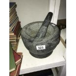 A heavy pestle and mortar