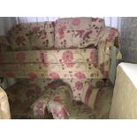 A floral patterned upholstered 3 piece suite