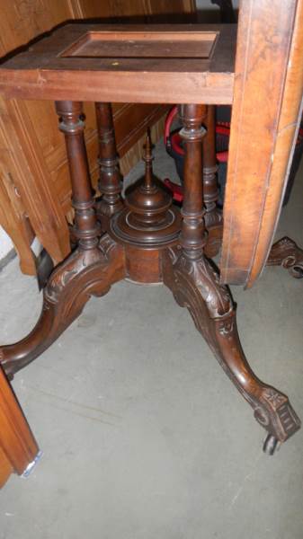A Victorian walnut oval inlaid tip top table with bird cage base. - Image 2 of 2