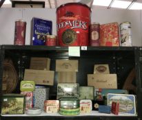 2 shelves of modern (new and aged) tins and wood cigar boxes