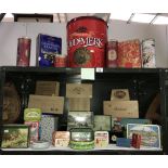 2 shelves of modern (new and aged) tins and wood cigar boxes