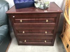 A darkwood stained 3 drawer chest