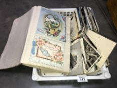 A box of postcards plus scrap book
