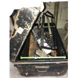 A tin trunk containing mitre saw etc.