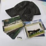 A pre war leather flying helmet and a quantity of aircraft photographs.