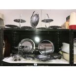 2 shelves of chrome plated metal ware including cake stands