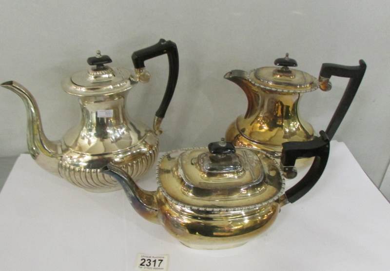 A silver plate teapot and 2 other silver plate pots.