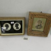 A framed and glazed silhouette of male and female together with a framed miniature of a gentleman.