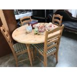 An extending dining table and 4 chairs