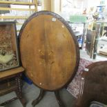 A mahogany inlaid tip top Victorian loo table.