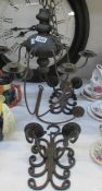 A mixed lot of wrought iron candle holders etc.