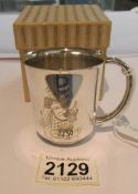 A boxed silver Christening mug, approximately 64 grams.