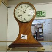 A Comitti of London mahogany mantel clock with key.