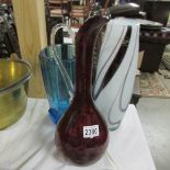 A Ruby glass jug and 2 coloured glass vases.