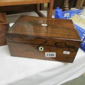 A Victorian rosewood sewing box.