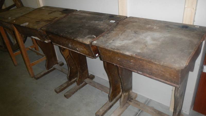 4 old school desks.