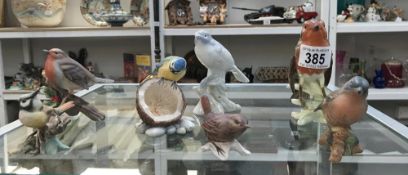 A quantity of bird figures including Beswick, Goebel, Bordes Fine Arts etc.